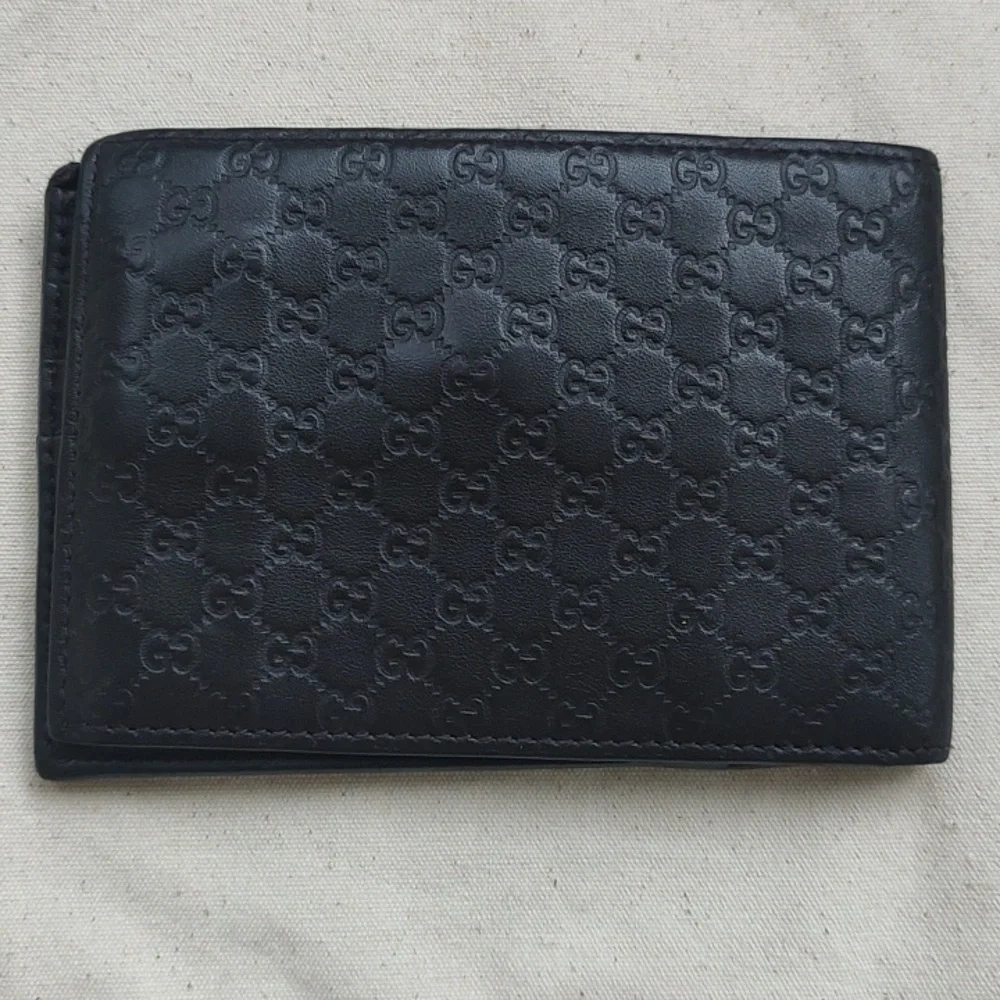 GUCCI Brown Leather MICRO GUCCISSIMA GG embossed Bi-fold wallet USED